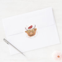 Weihnachtskühe mit roter Weihnachtsmannmütze