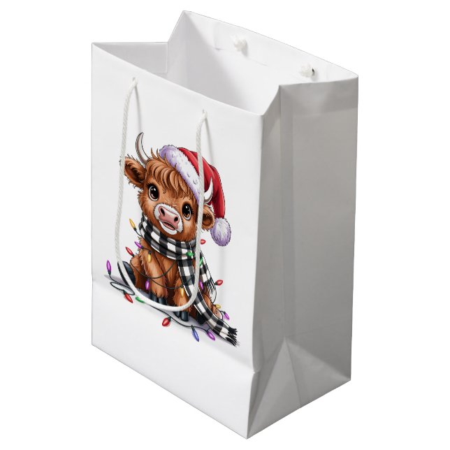 Weihnachtslicht Hochland-Kuh-Weihnachtsmannmütze Mittlere Geschenktüte (Vorderseite Schrägansicht)