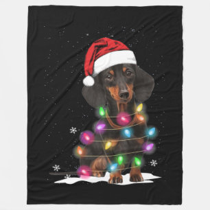Weihnachtslicht mit Schnee in der Dackel Fleecedecke