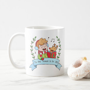 Weihnachtsliedjunge und Rentier Fröhliche Tasse