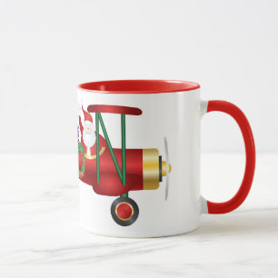 Weihnachtsmann, der auf Doppeldecker mit der Tasse