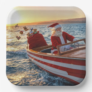 Weihnachtsmann fährt ein Speedboot Pappteller