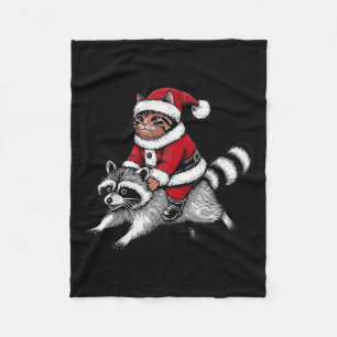 Weihnachtsmann-Katze reitet auf einem Waschbären W Fleecedecke