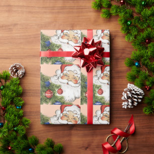 Weihnachtsmann mit Weihnachtsbaumschmuck im Vintag Geschenkpapier