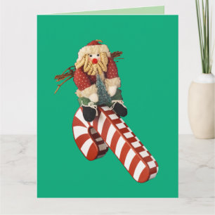 Weihnachtsmann spielt auf einer Zuckerstangenrutsc Karte