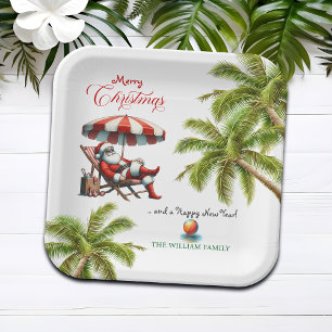 Weihnachtsmann unter einem Strandsonnenschirm Pappteller