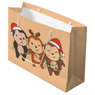 Weihnachtsmänner am Affen Niedliche Affen La Große Geschenktüte