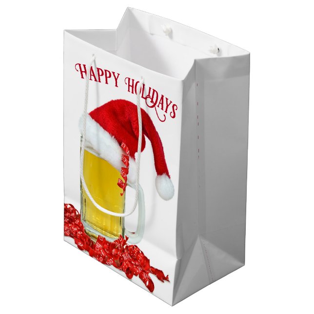 Weihnachtsmannmütze auf Bier-Tasse Mittlere Geschenktüte (Vorderseite Schrägansicht)