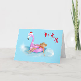 Weihnachtsmannmütze auf einer rosa Flamingo-Floatk Karte