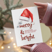 Weihnachtsmannmütze und Schneeflocken, fröhlich un