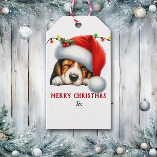 Weihnachtsmannmütze zwinkerndes Basset Hound Welpe Geschenkanhänger