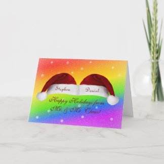 Weihnachtsmannmützen und Regenbogen Feiertagskarte