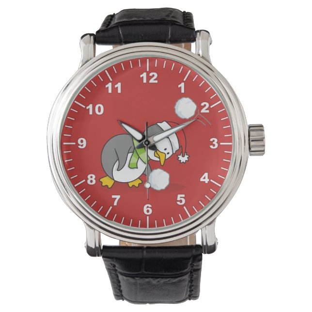 Weihnachtspinguin bekommt eine Schneeball Armbanduhr (Vorderseite)