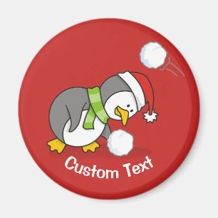 Weihnachtspinguin bekommt eine Schneeball Magnet