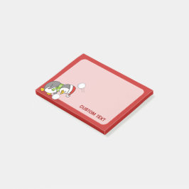 Weihnachtspinguin bekommt eine Schneeball Post-it Klebezettel