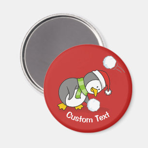 Weihnachtspinguin bekommt einen Schneeball Magnet