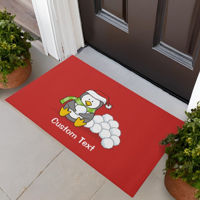 Weihnachtspinguin sitzend mit Schneebälle Fußmatte (Von Creator hochgeladen)