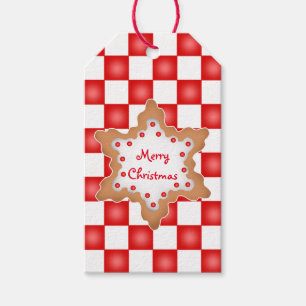 Weihnachtsplätzchen auf rotem und weißem geschenkanhänger