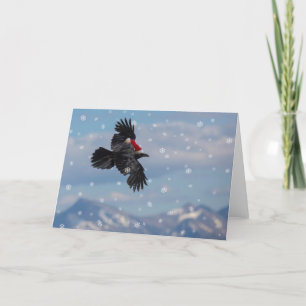 Weihnachtsrabe überfliegt schneebedeckte Berge Karte