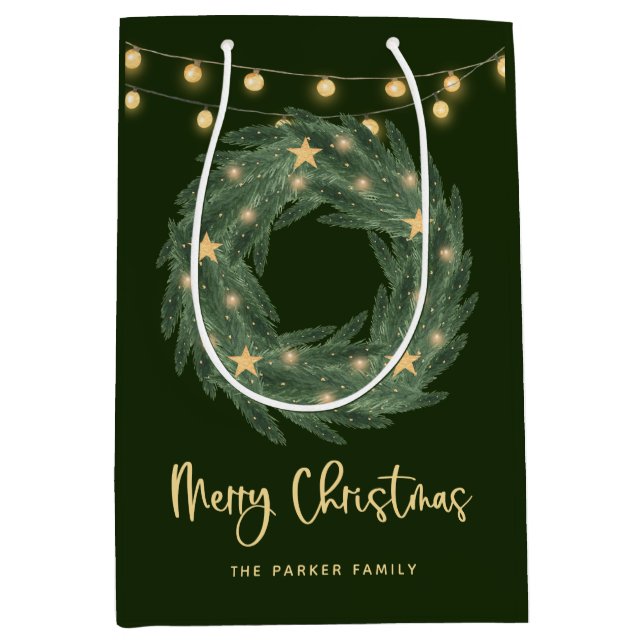 Weihnachtsreich mit goldenen String-Leuchten auf G Mittlere Geschenktüte (Vorderseite)