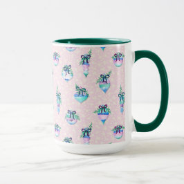 Weihnachtsschmuck und Schnee in Rosa Tasse