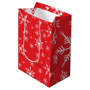 Weihnachtsschneeflocke auf Rot Mittlere Geschenktüte