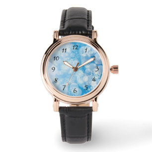Weihnachtsschneeflocken auf blauem Hintergrund     Armbanduhr