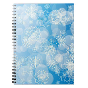 Weihnachtsschneeflocken auf blauem Hintergrund Notizblock