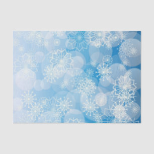 Weihnachtsschneeflocken auf blauem Hintergrund Seidenpapier