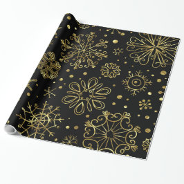 Weihnachtsschneeflocken aus Gold auf schwarz Geschenkpapier