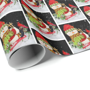 Weihnachtsschneemann auf Schlitten Geschenkpapier