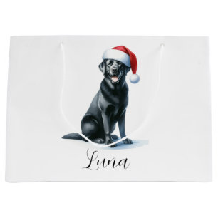 Weihnachtsschwarzer Labrador Hund in Weihnachtsman Große Geschenktüte