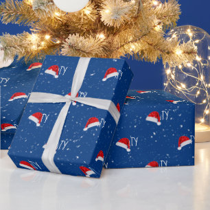 Weihnachtstext mit Weihnachtsmannmützen Geschenkpapier