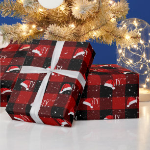 Weihnachtstext mit Weihnachtsmannmützen Geschenkpapier