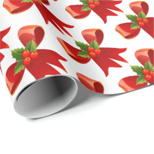 Weihnachtsverpackung mit roter Schleife und Stechp Geschenkpapier
