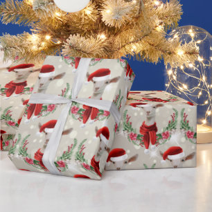 Weihnachtsziege Kind 2 in Weihnachtsmannmütze und  Geschenkpapier