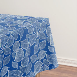 Weiße Blätter auf Blue Tablecloth Tischdecke