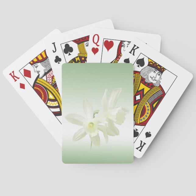 Weiße Blume auf grünen Spielkarten (Rückseite)
