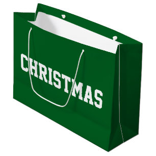 Weiße CHRISTMAS-Fettschrift auf festlichem Waldgrü Große Geschenktüte