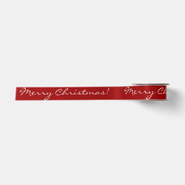 Weiße frohe Weihnachts-Script-Kalligrafie auf rot Satinband