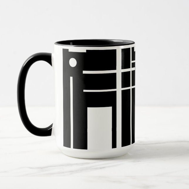 Weiße geometrische Formen auf der schwarzen Tasse (Links)