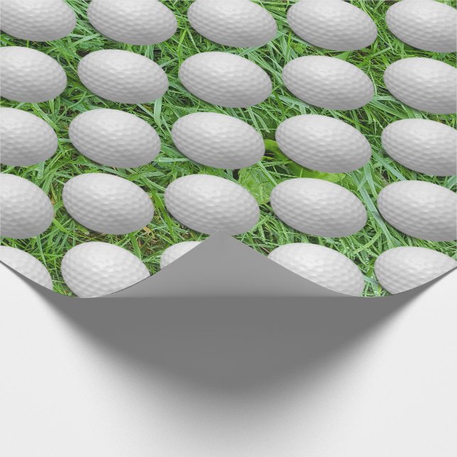 weiße Golfbälle auf grünem Gras Geschenkpapier (Ecke)