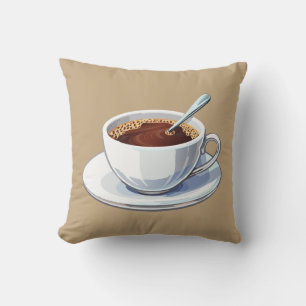 Weiße Kaffeetasse auf einem Unterteller gefüllt mi Kissen