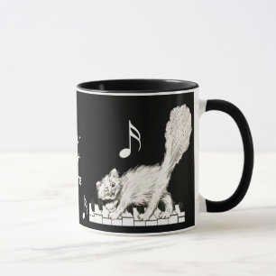 Weiße Katze auf Klaviertasten Tasse