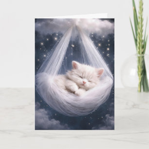 Weiße Katze hängt in einer Tüll-Hängematte und Wol Karte