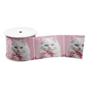 Weiße Katze mit rosa Mütze Satinband