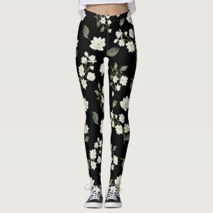 Weiße Magnolische Blume auf schwarzen Leggings