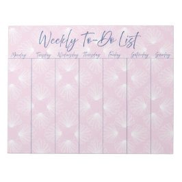 Weiße Muscheln auf hellrosa Liste Notizblock