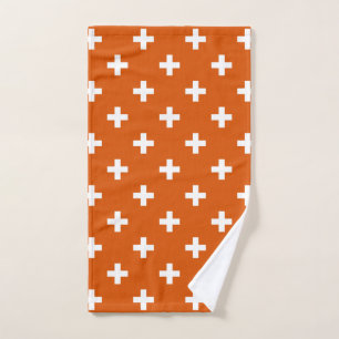 Weiße Polka-Kreuze auf verbrannter Orange Handtuch