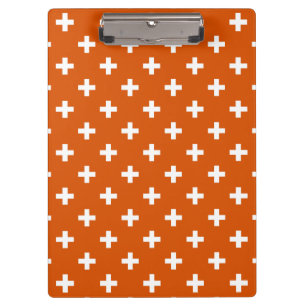 Weiße Polka-Kreuze auf verbrannter Orange Klemmbrett